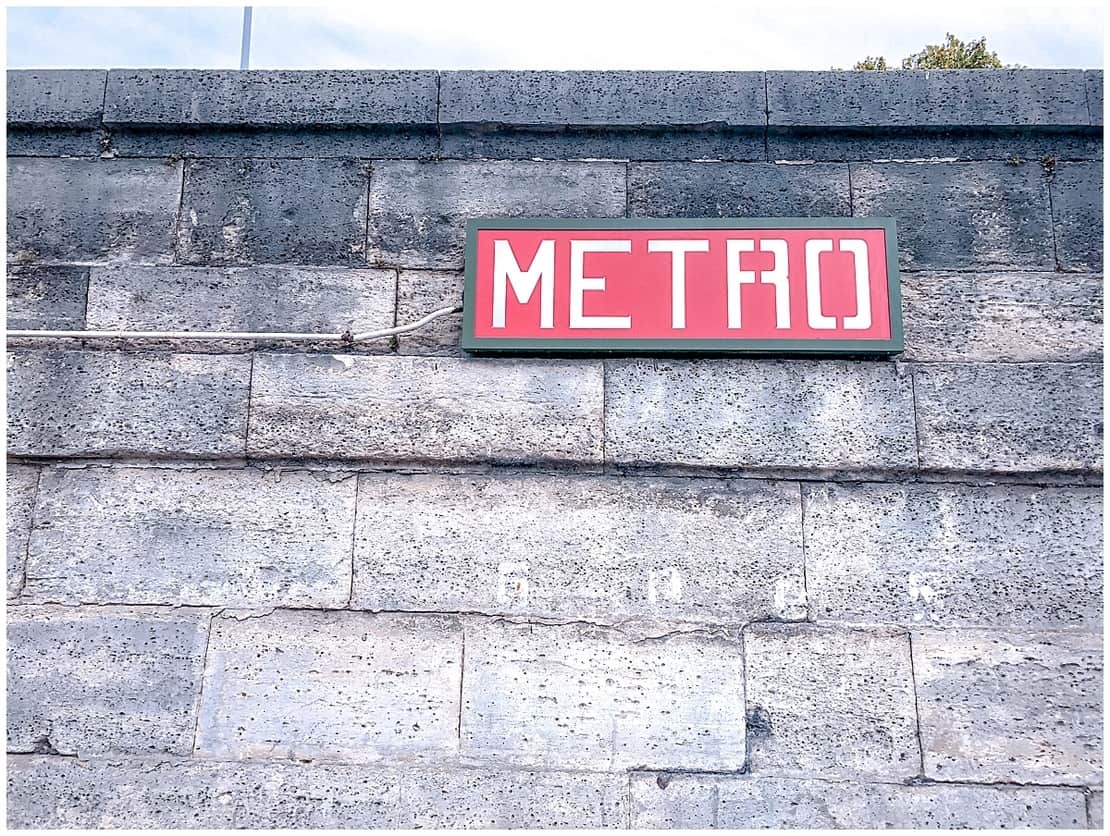 Metro sign on a wall in Paris - Paris with kids