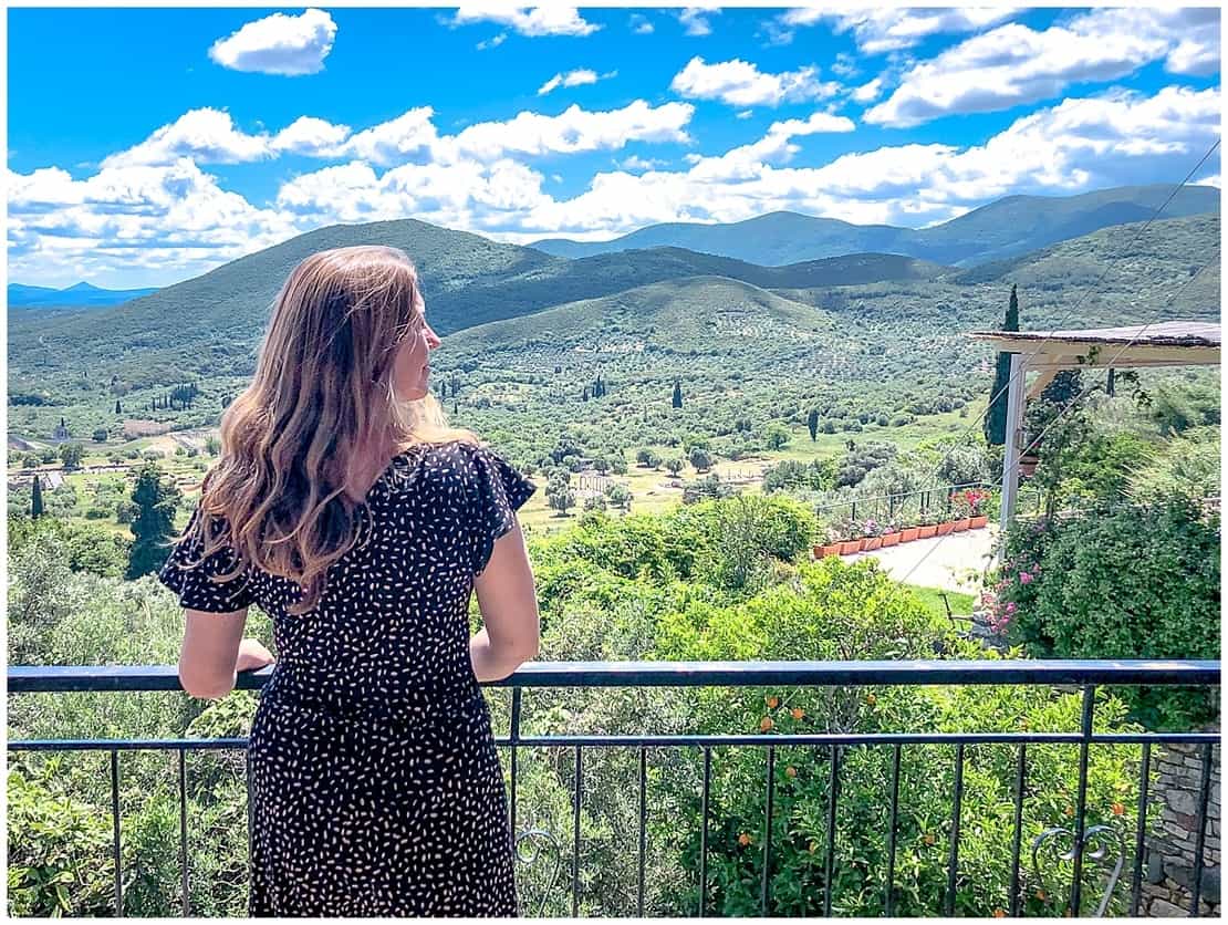 Abigail King overlooking the ancient city of Messene in Greece - Best Peloponnese Itineraries