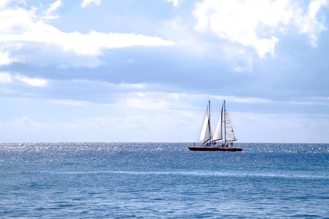 Catamaran sailing on the ocean in Barbados - Jamaica vs Barbados