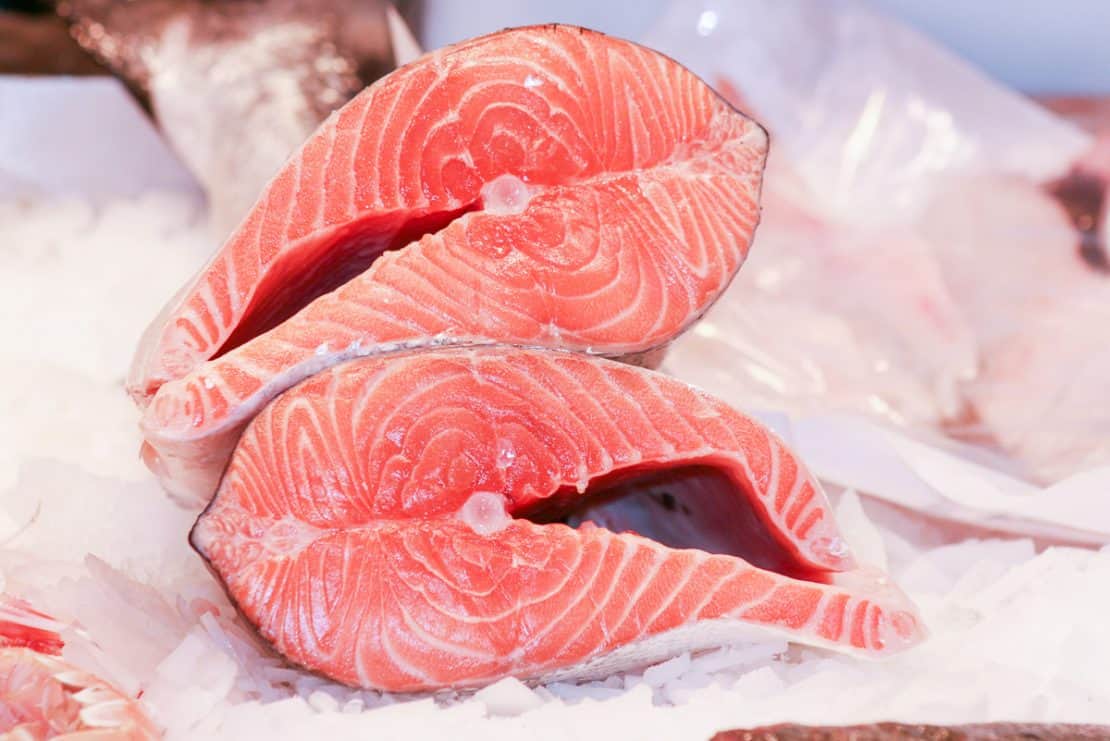 Fresh salmon on ice at a fishmongers in Barcelona, Spain 