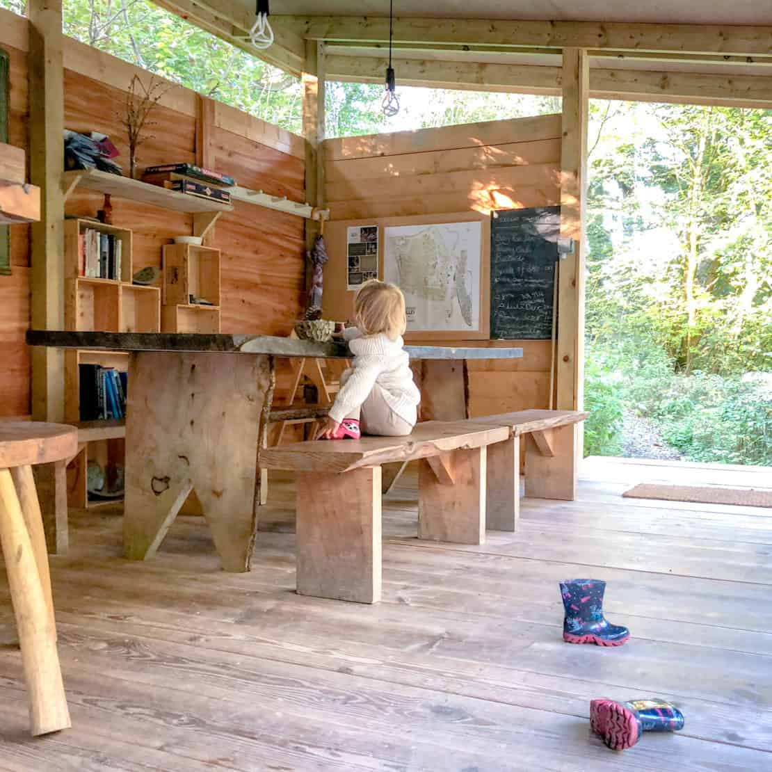 Child playing in a glamping games room 