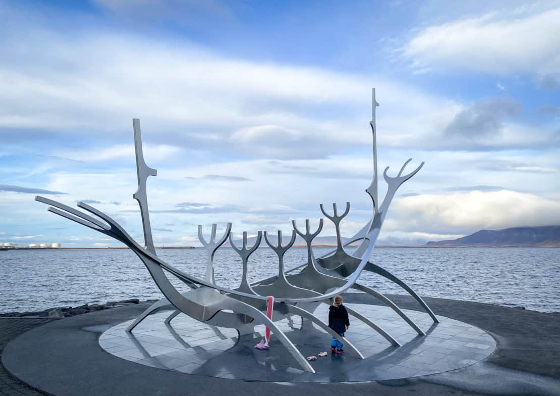 Iceland - Reykjavik - Sun Voyager sculpture with small child looking out to sea