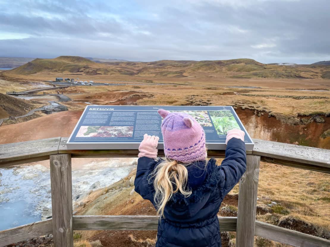 Girl looking out over Krysuvik Geothermal area in Iceland