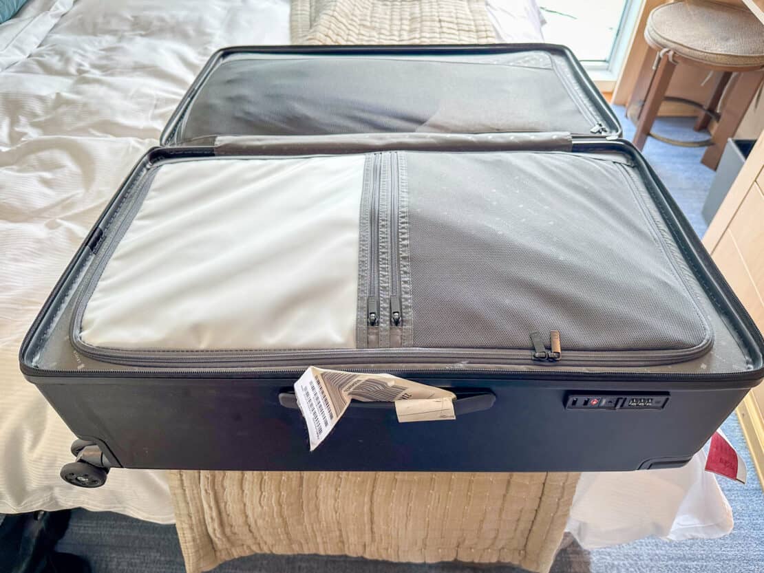 Zipped compartments inside an open Level8 suitcase 