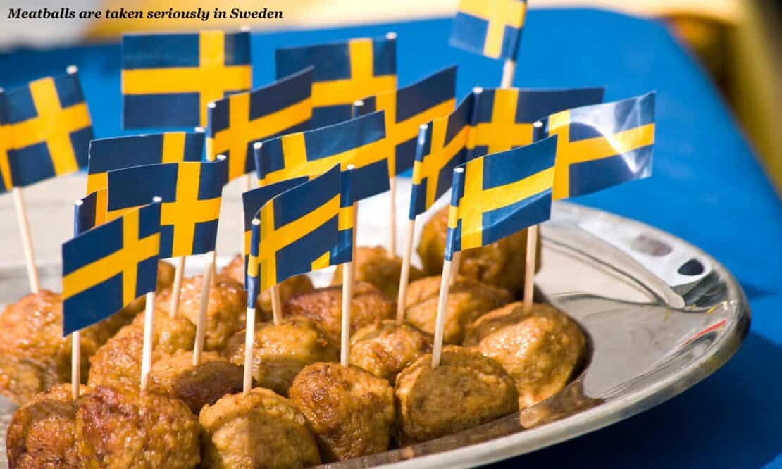 Plate of swedish meatballs with swedish flags, fun facts about sweden 