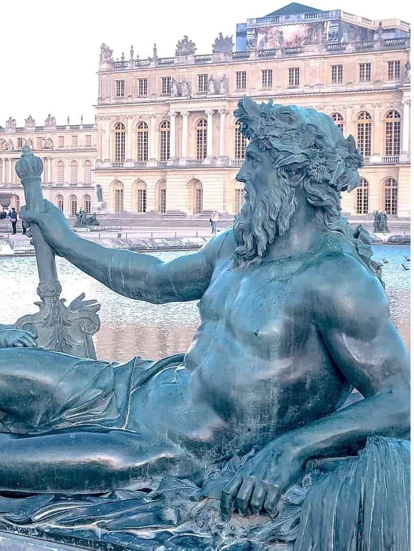 Neptune reclining in front of Palace of Versailles - Paris with kids