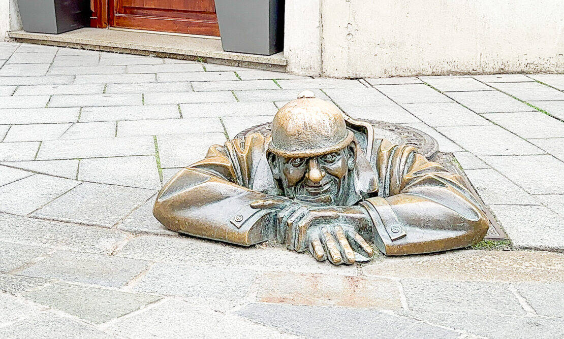 Bratislava Cumil drain man outdoor sculpture