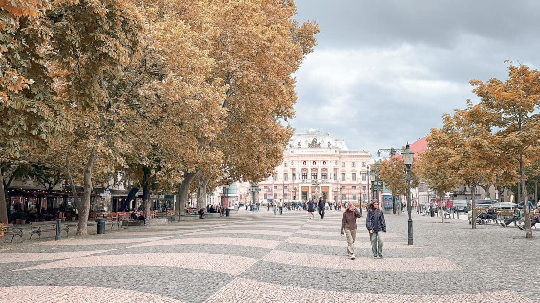 Pedestrians walking through the city of Bratislava - is Bratislava worth visiting? 