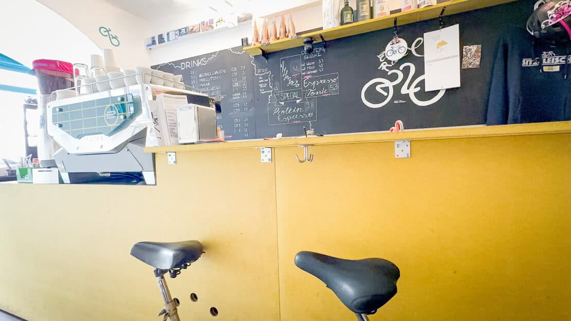 Inside CoffeeRide in Graz Austria with bicycle seats as seats