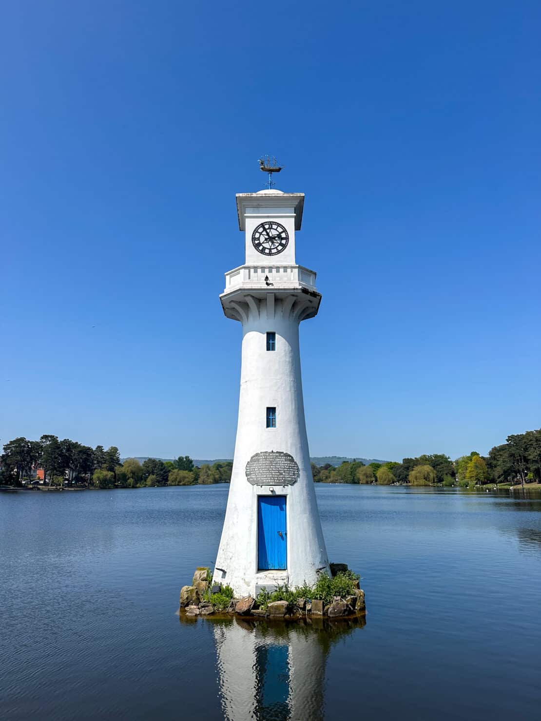 Roath Park Memorial Lighthouse in Cardiff on a sunny day