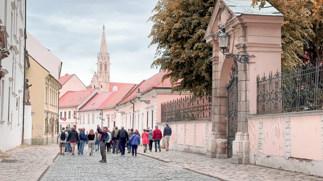 People walking through the old town of bratislava, slovakia - is bratislava worth visiting? 