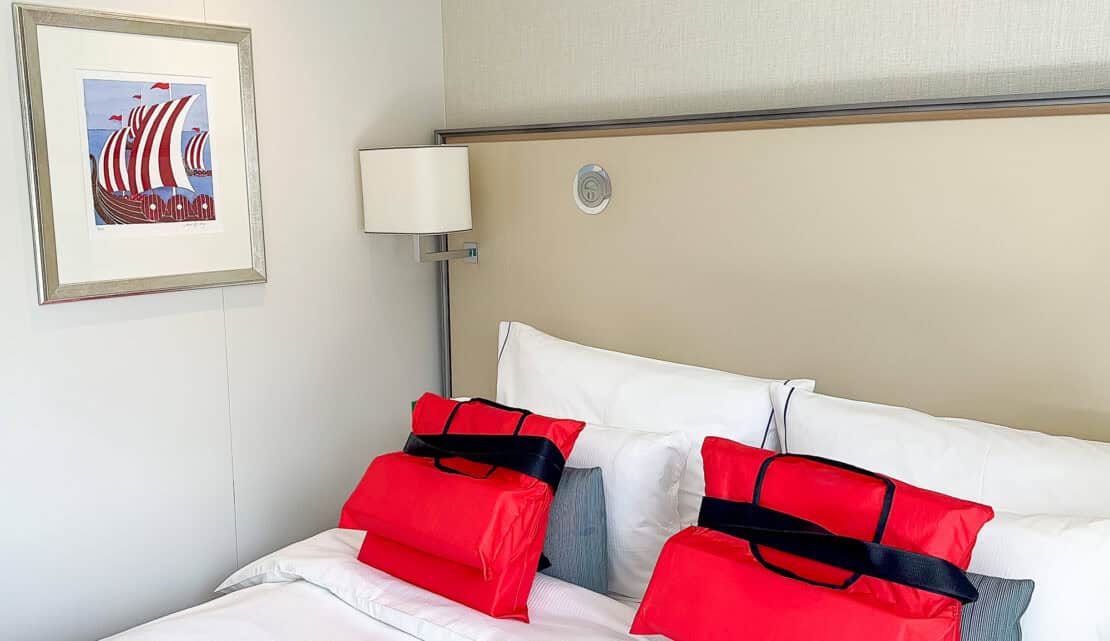 Lifejackets on the bed in the stateroom on board the Viking Aegir river cruise - Viking Aegir review