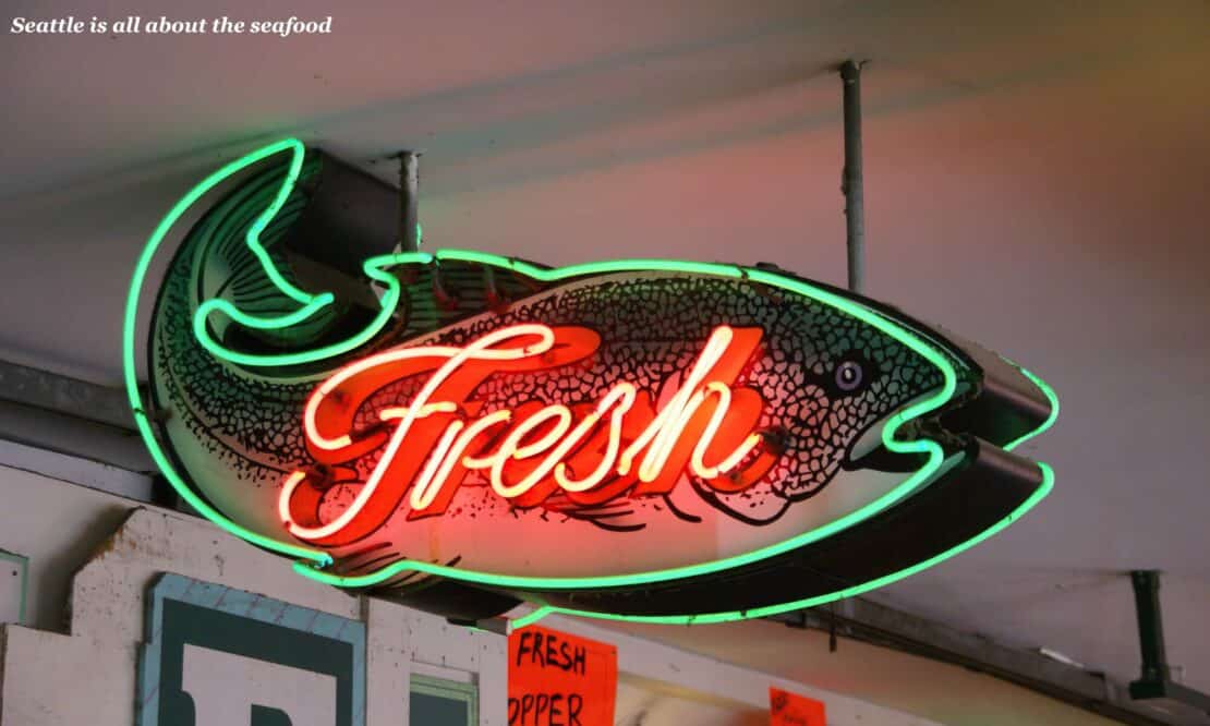 Neon fish sign at Pike Place Market in Seattle - is Seattle worth visiting 