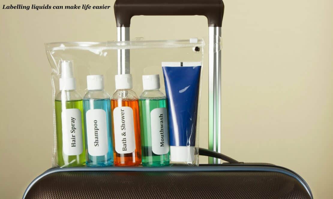 Travel toiletries in a clear bag labelled  - minimalist packing list 