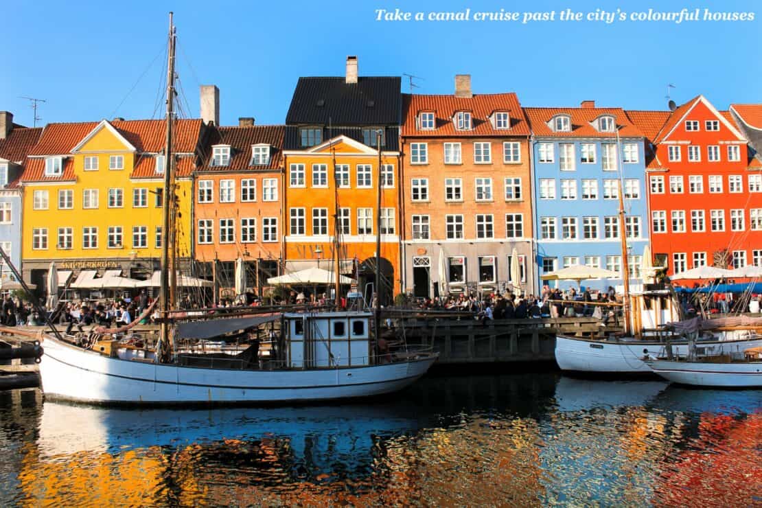 Boats docked by colourful houses in Copenhagen, Denmark - 48 hours in Copenhagen 