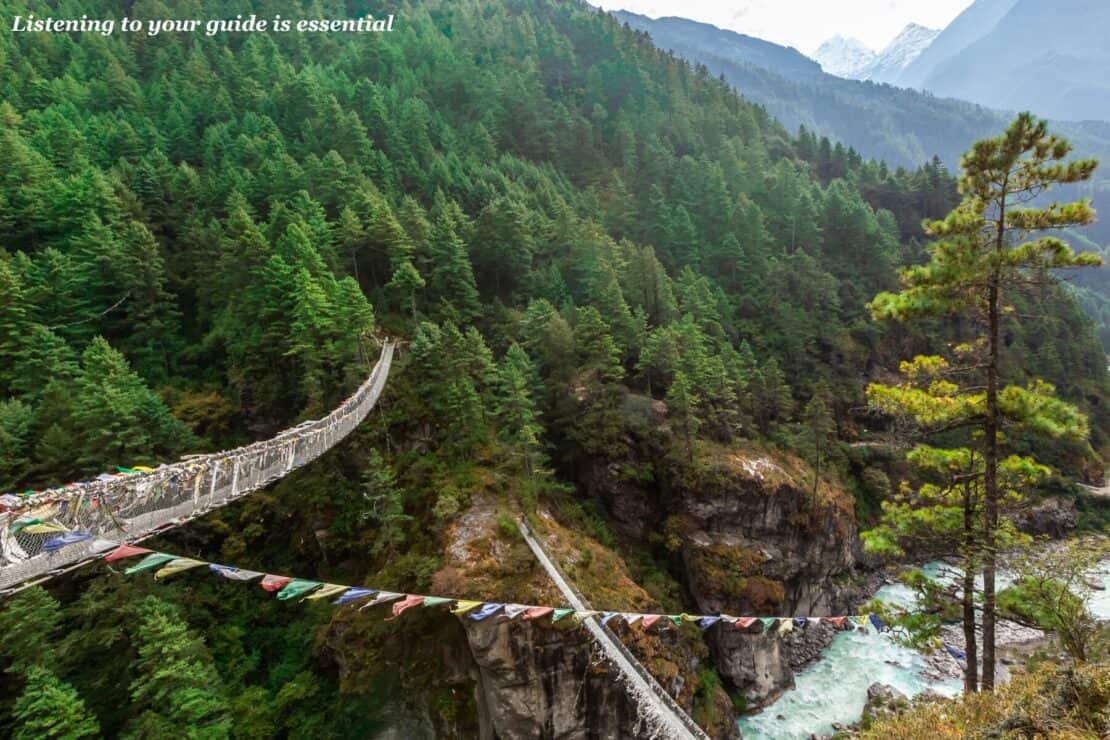 Rope bridge in the trees on the trek to Everest base camp un Nepal - Restricted Area Permits in Nepal